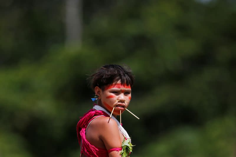 A girl from the indigenous Yanomami ethnic group looks on at the 4th Surucucu Special Frontier Platoon of the Brazilian army in the municipality of Alto Alegre