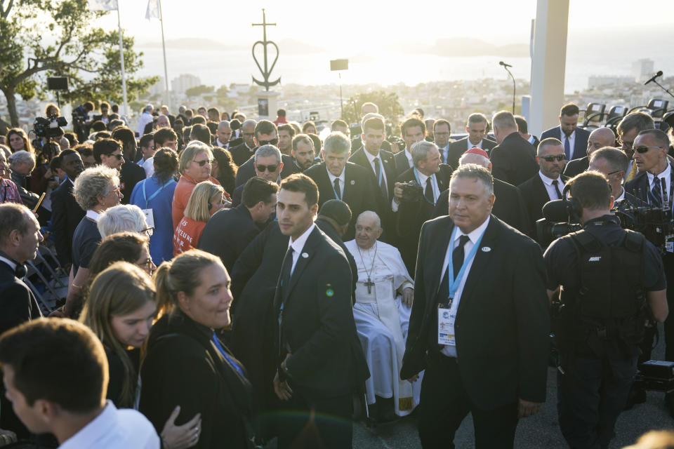 Pope Francis, centre, leaves after a moment of reflection with religious leaders next to the Notre Dame de la Garde Basilica in Marseille, France, Friday, Sept. 22, 2023. Francis, during a two-day visit, will join Catholic bishops from the Mediterranean region on discussions that will largely focus on migration. (AP Photo/Pavel Golovkin)