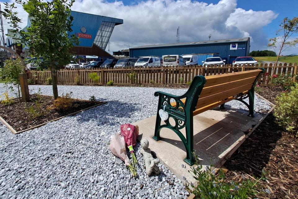 Flowers in tribute to Andrew Jenkins were left next to the memorial bench in United's memory garden today - overlooked by the Andrew Jenkins Stand <i>(Image: News & Star)</i>