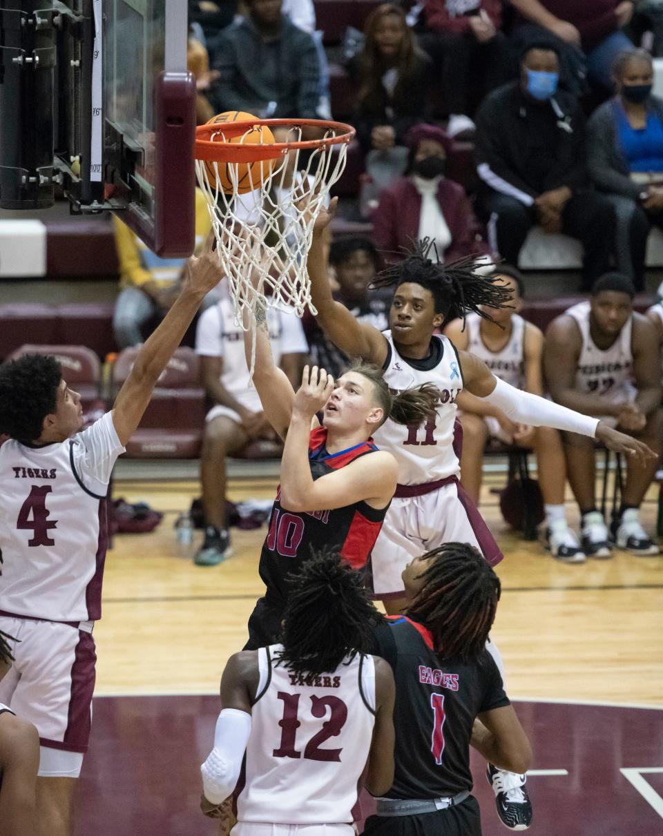 Robert Ward (10) shoots for two during the Pine Forest vs PHS boys basketball game at Pensacola High School on Friday, Jan. 14, 2022.