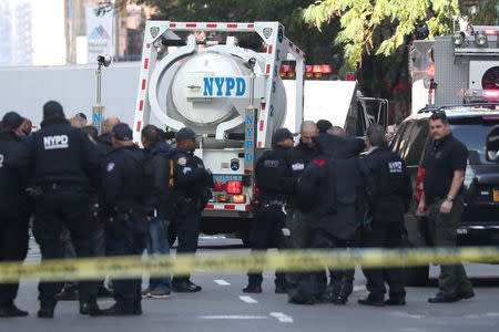 Members of the New York Police Department are seen outside the Time Warner Center after a suspicious package was found inside the CNN Headquarters in Manhattan, New York, U.S., October 24, 2018. REUTERS/Shannon Stapleton