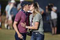 Carlos Ortiz, left, kisses wife, Haley Ortiz, after winning the Houston Open golf tournament, Sunday, Nov. 8, 2020, in Houston. (AP Photo/Eric Christian Smith)