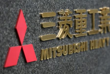 Japan's Mitsubishi Heavy Industries' logo is pictured outside the company headquarters in Tokyo in this December 17, 2012 file photo. REUTERS/Yuriko Nakao/Files