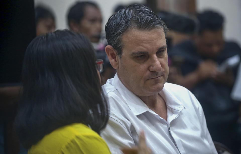 Australian Troy Smith, who is accused of drug possession, listens to his interpreter during his trial at Denpasar district court, Bali, Indonesia on Thursday, June 27, 2024. Indonesian police arrested Smith on April 30 after he was allegedly caught with methamphetamine in his hotel. (AP Photo/Firdia Lisnawati)