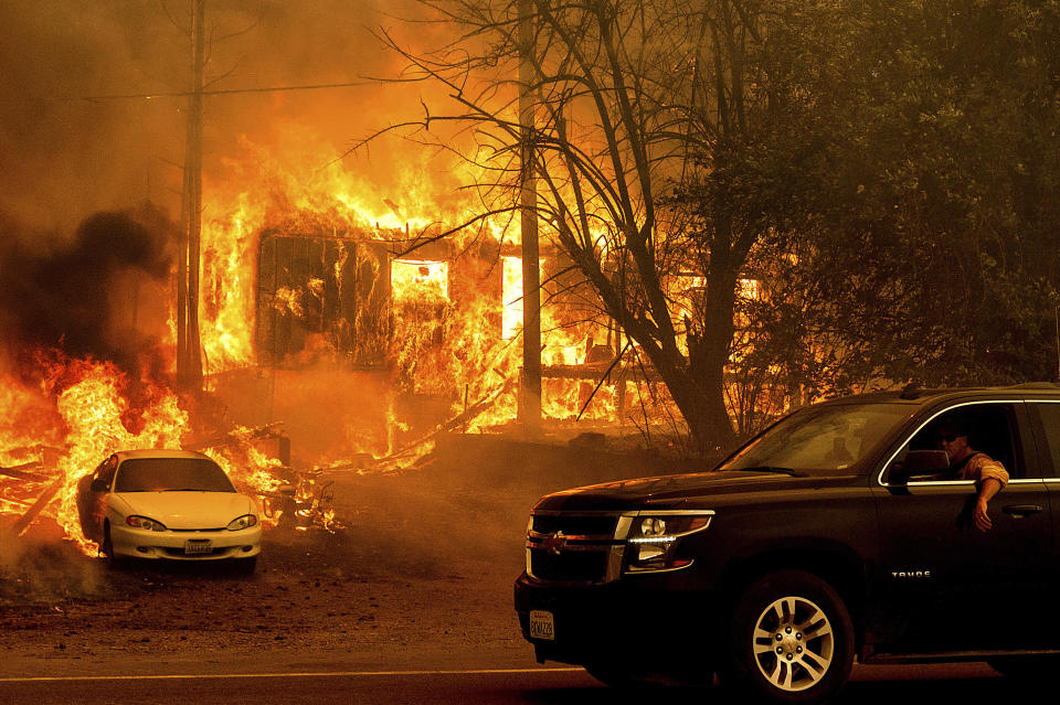 Flames from the Dixie Fire consume a home on Highway 89 south of Greenville on August 5, 2021, in Plumas County, California. / Credit: Noah Berger / AP
