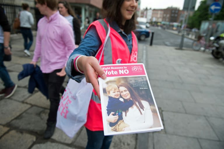 Campaigners for the Love Both pro-life campaign canvass members of the public, urging people to vote 'no' in the referendum to repeal the eighth amendment of the Irish constitution, in Dublin on May 24, 2018