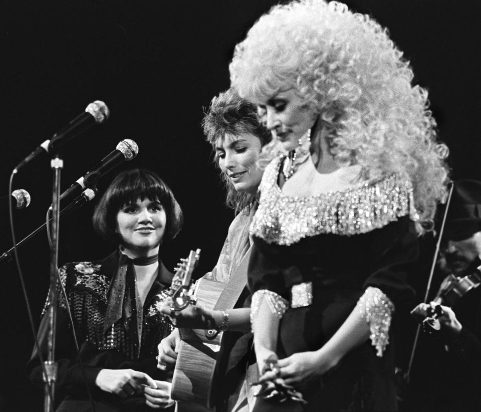 Linda Ronstadt's birthday is July 15, 1946. Here, The Trio of Ronstadt, left, Emmylou Harris and Dolly Parton perform together during the CMA Awards show at the Grand Ole Opry House Oct. 13, 1986.