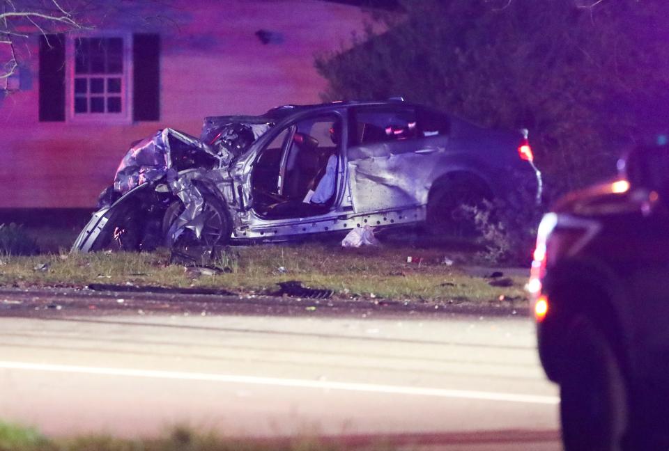 A vehicle involved in an accident that left two people dead rests off Wrangle Hill Road near Mabel Lane shortly after 10 p.m. Wednesday, April 10, 2024.