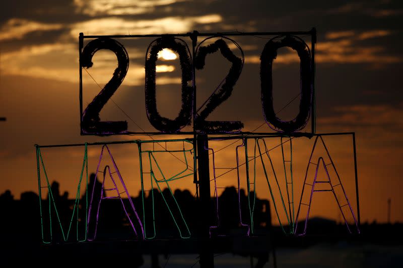 Sign of 2020 is seen on a beach during the last sunset of 2019, in Gaza City