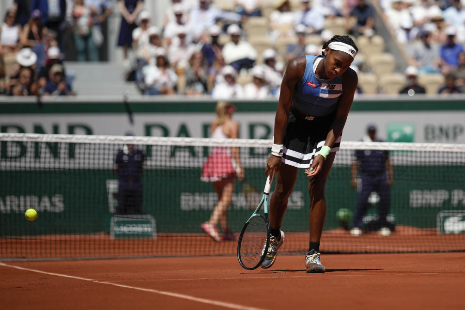 Coco Gauff of the U.S. reacts after missing a shot against Russia's Mirra Andreeva during their third round match of the French Open tennis tournament at the Roland Garros stadium in Paris, Saturday, June 3, 2023. (AP Photo/Christophe Ena)