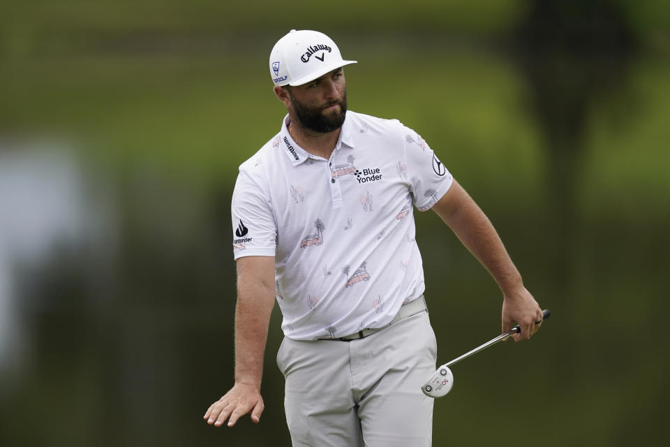 Jon Rahm follows his putt on the ninth green during the first round of the St. Jude Championship golf tournament Thursday, Aug. 10, 2023, in Memphis, Tenn. (AP Photo/George Walker IV)