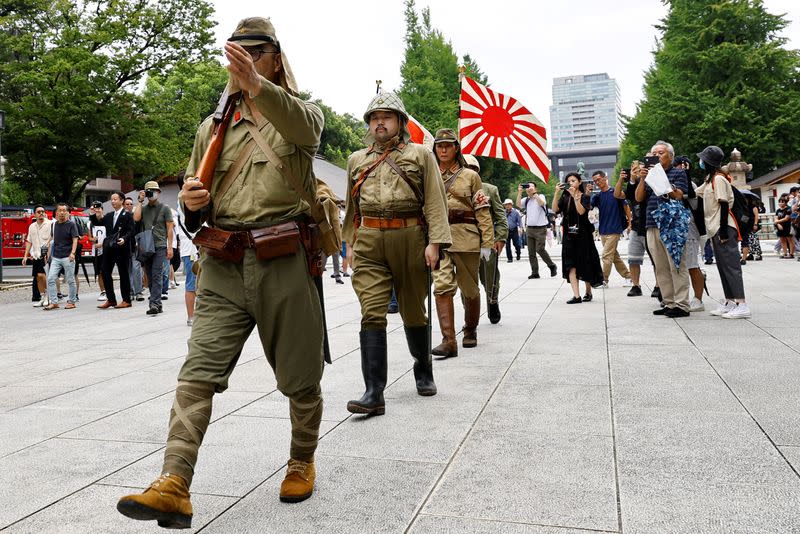 FILE PHOTO: People pay tribute to the war dead on the 78th anniversary of Japan's surrender in World War Two, in Tokyo