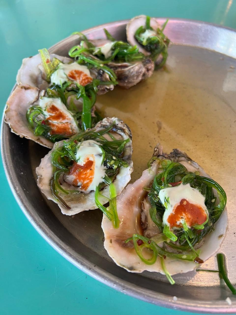We tried the specialty "Godzilla" oysters. Raw oysters are topped with tangy seaweed salad, cucumber wasabi and spicy "pirate" sauce.