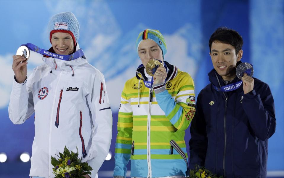 Medal winners in the men's normal hill nordic combined, from left, Norway's Magnus Krog, bronze, Germany's Eric Frenzel, gold, and Japan's Akito Watabe, silver, pose with their medals at the 2014 Winter Olympics in Sochi, Russia, Thursday, Feb. 13, 2014. (AP Photo/Morry Gash)