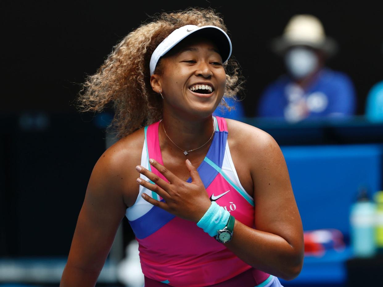 Naomi Osaka laughs.