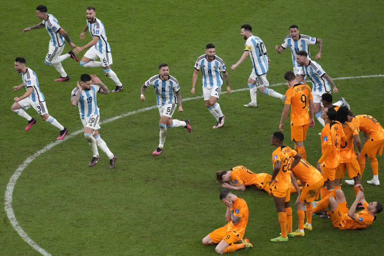 Argentina players celebrate after the World Cup quarter-final soccer match between the Netherlands and Argentina at the Lusail Stadium in Lusail, Qatar, Saturday, Dec. 10, 2022.  (AP Photo/Thanasis Stavrakis)