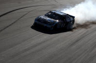 AVONDALE, AZ - MARCH 04: Denny Hamlin, driver of the #11 FedEx Office Toyota, celebrates with a burn out after winning the NASCAR Sprint Cup Series SUBWAY Fresh Fit 500 at Phoenix International Raceway on March 4, 2012 in Avondale, Arizona. (Photo by Christian Petersen/Getty Images)