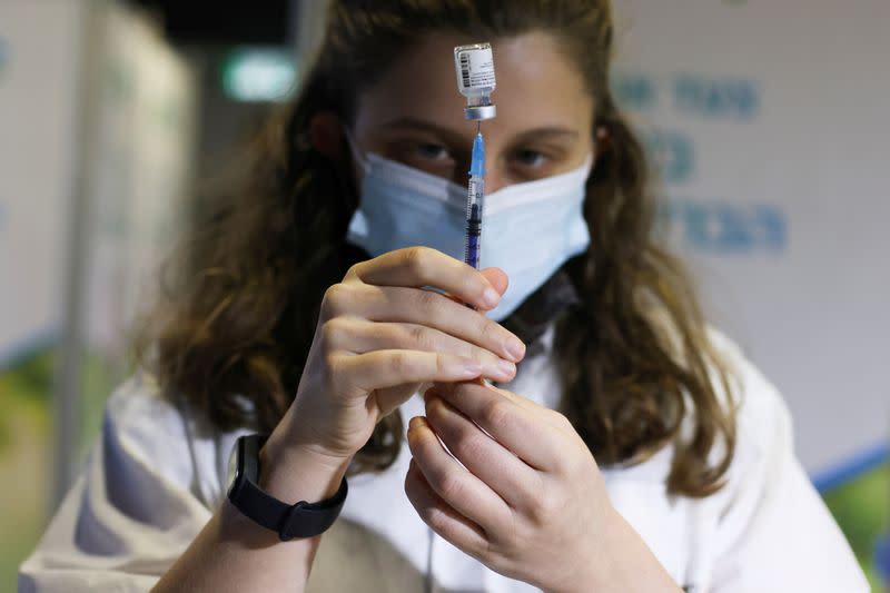 FILE PHOTO: A medical worker prepares to administer a vaccination against the coronavirus disease (COVID-19), in Jerusalem