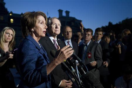 U.S. House Minority Leader Nancy Pelosi (D-CA) (2nd L) speaks to the media, beside Senate Majority Leader Harry Reid (D-NV), following their meeting with U.S. President Barack Obama, House Speaker John Boehner (R-OH) and Senate Minority Leader Mitch McConnell (R-KY), at the White House in Washington, October 2, 2013. REUTERS/Jason Reed