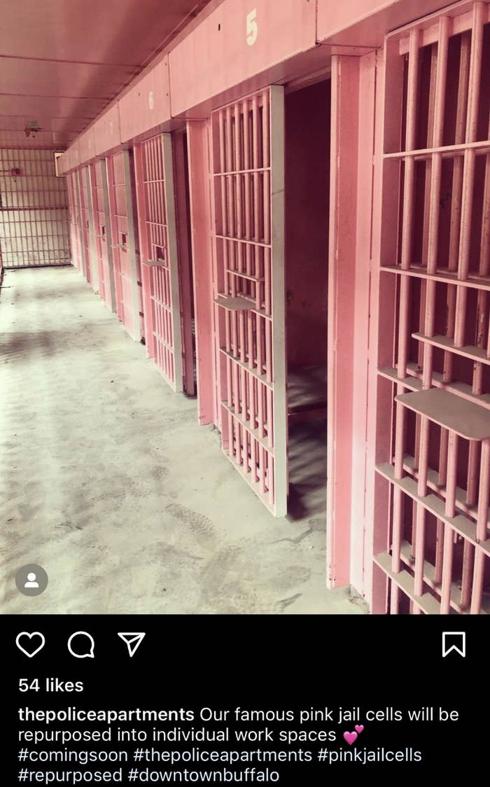 concrete floors with dirty footprints and pink jail cells