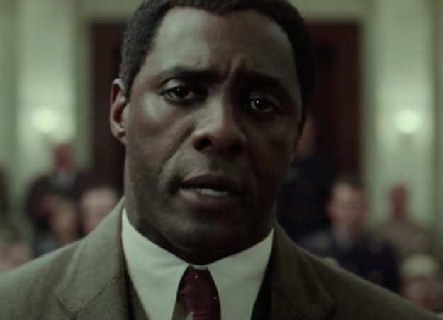 Idris Elba as Nelson Mandela speaks in a court room