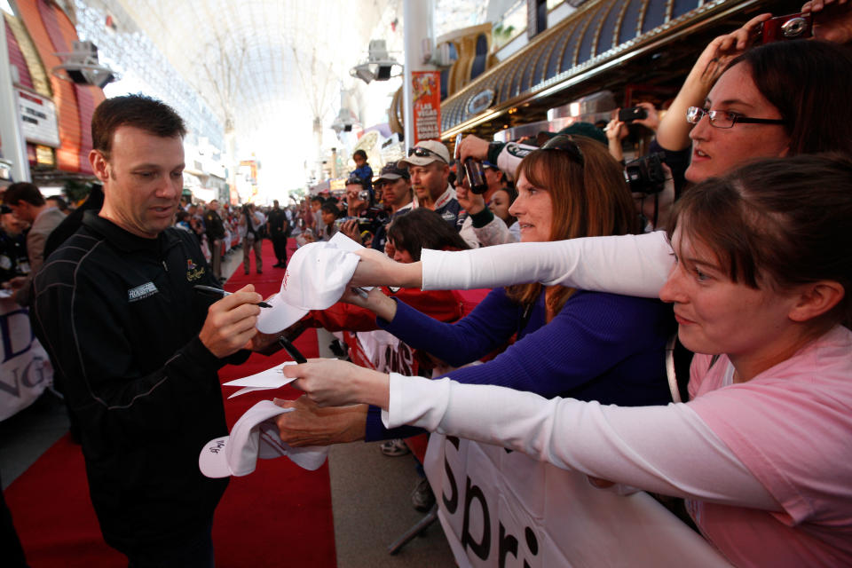LAS VEGAS, NV - NOVEMBER 30: Driver Matt Kenseth signs his autograph at the Fan Fesitval presented by Las Vegas Motor Speedway during the NASCAR Sprint Cup Series Champion's Week at the Fremont Street Experience on November 30, 2011 in Las Vegas, Nevada. (Photo by Chris Graythen/Getty Images for NASCAR)