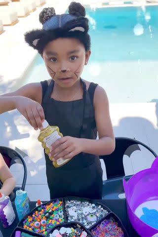 <p>Khloe Kardashian/Instagram</p> True Thompson dressed as a black cat at the party