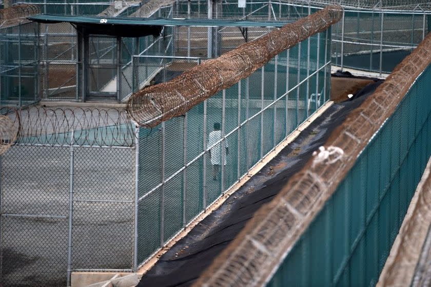 File photo shows an unidentified detainee walking in the excercise yard of the 'Camp 6' detention facility at the US Naval Station in Guantanamo Bay, Cuba. — AFP pic