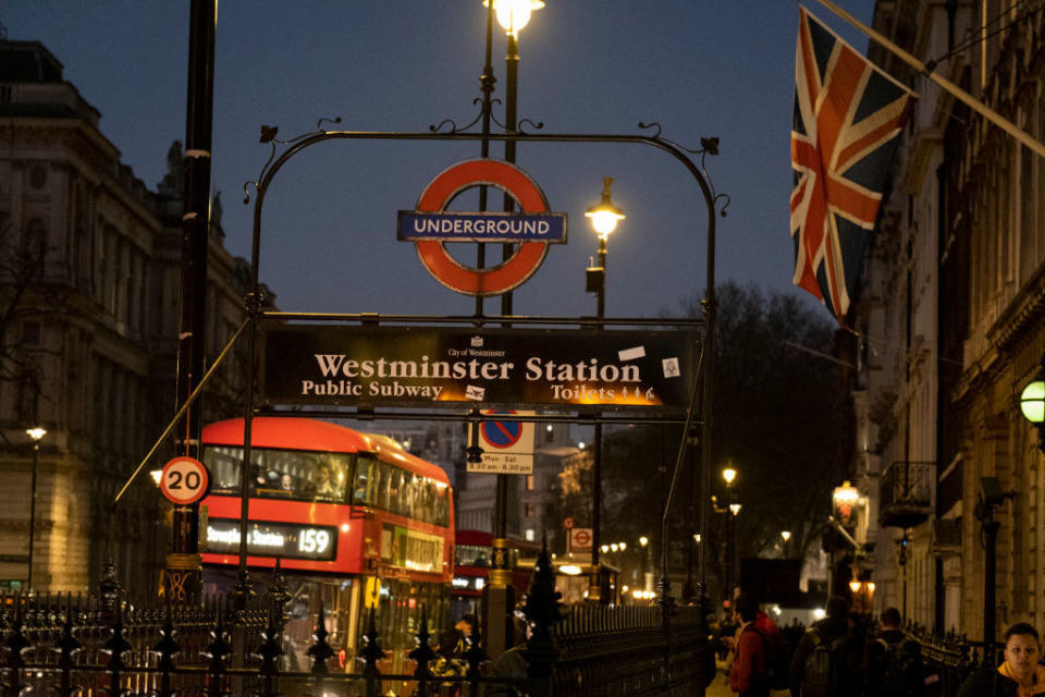 An entrance to Westminster Underground Station, is seen with rush-hour bus traffic