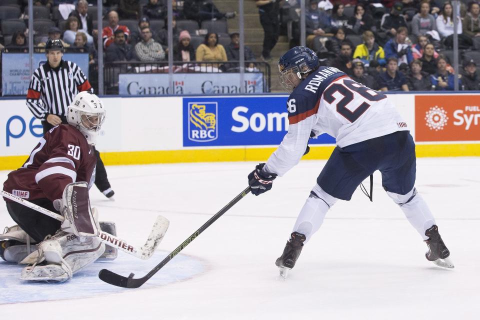 Slovakia's Milos Roman scores on Latvia goaltender Mareks Mitens during the second period of a world junior hockey championship game in Toronto, Friday, Dec. 30, 2016. (Chris Young/The Canadian Press via AP)