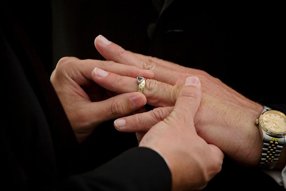 A couple exchanges rings at their wedding held at West Hollywood Park in California in June 2008. <a href="https://www.gettyimages.com/detail/news-photo/same-sex-couple-exchagnes-rings-at-their-wedding-held-at-news-photo/539890754?adppopup=true" rel="nofollow noopener" target="_blank" data-ylk="slk:Ted Soqui/Corbis via Getty Images;elm:context_link;itc:0;sec:content-canvas" class="link ">Ted Soqui/Corbis via Getty Images</a>