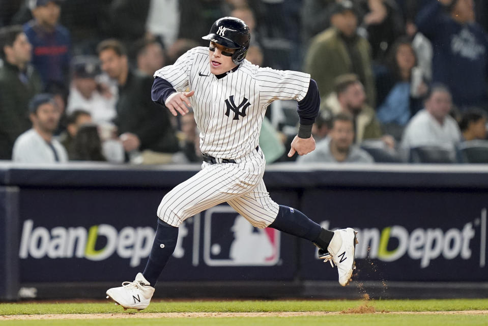 New York Yankees Harrison Bader rounds third base on his way to score against the New York Yankees during the fourth inning of Game 4 of an American League Championship baseball series against the Houston Astros, Sunday, Oct. 23, 2022, in New York. (AP Photo/John Minchillo)