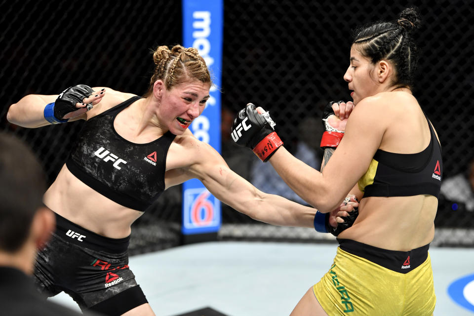 LAS VEGAS, NEVADA - DECEMBER 14:  (L-R) Irene Aldana of Mexico strikes Ketlen Vieira of Brazil in their women's bantamweight bout during the UFC 245 event at T-Mobile Arena on December 14, 2019 in Las Vegas, Nevada. (Photo by Jeff Bottari/Zuffa LLC)