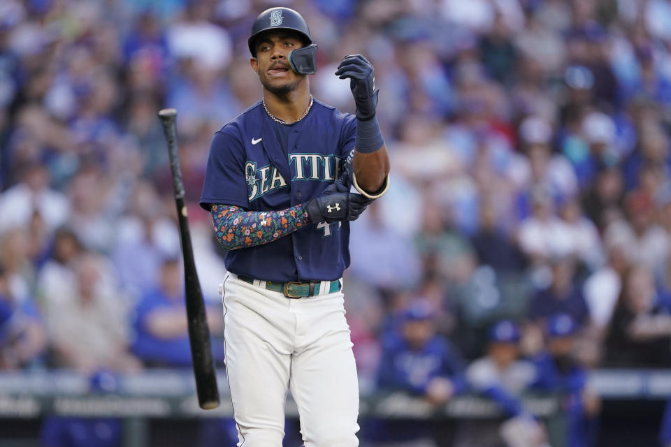 Seattle Mariners' Julio Rodriguez tosses his bat after he was walked during the first inning of the team's baseball game against the Toronto Blue Jays, Thursday, July 7, 2022, in Seattle. (AP Photo/Ted S. Warren)