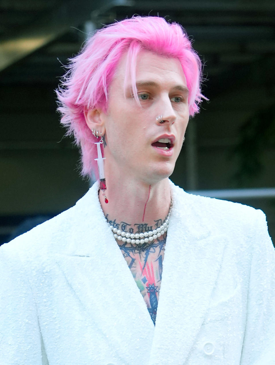 close up of MGK and the earring