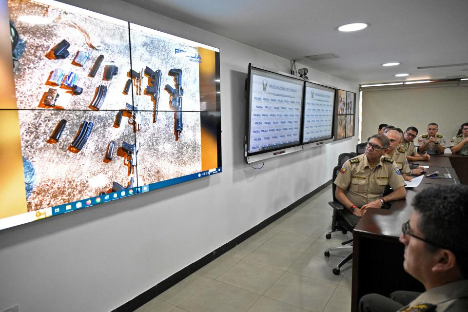 Ecuador's Interior Minister Juan Zapata (covered) and Police commanders give a report on the arrests done so far over the assassination on the eve of Ecuadorean presidential candidate Fernando Villavicencio, at the headquarters of the Police in Quito, on August 10, 2023.