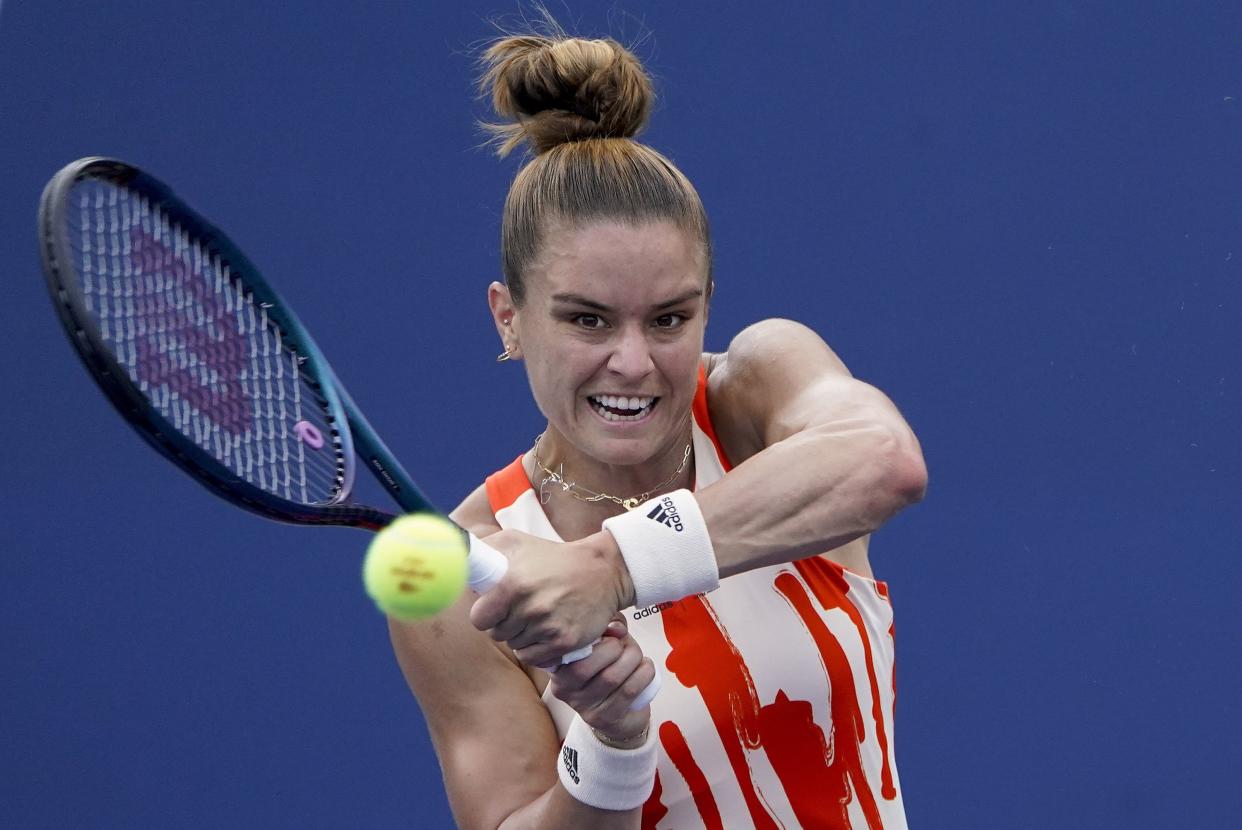 Maria Sakkari, of Greece, returns a shot to Tatjana Maria, of Germany, during the first round of the U.S. Open tennis championships, Monday, Aug. 29, 2022, in New York.