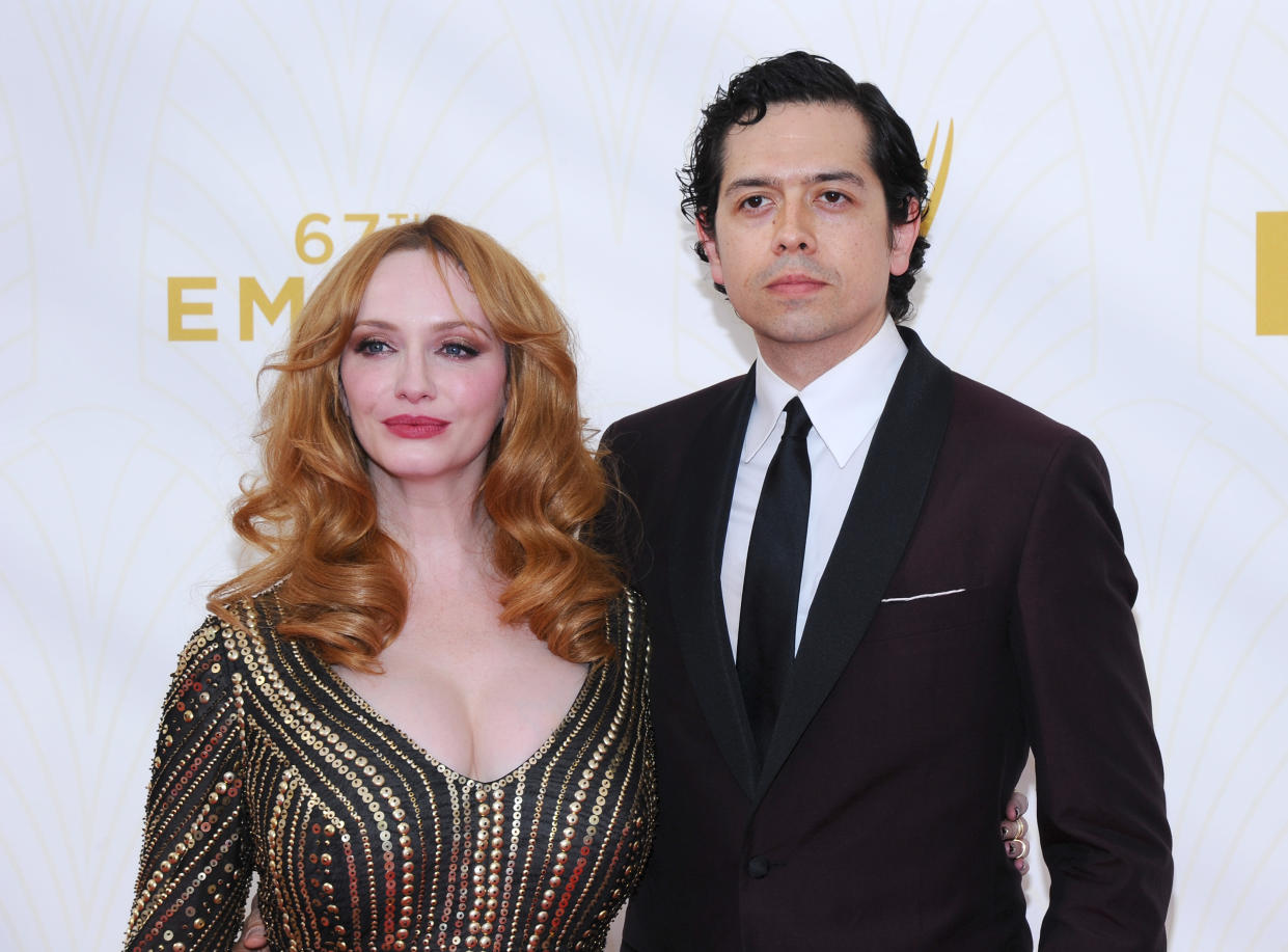 Christina Hendricks, left, and Geoffrey Arend arrive at the 67th Primetime Emmy Awards on Sunday, Sept. 20, 2015, at the Microsoft Theater in Los Angeles. (Photo by Vince Bucci/Invision for the Television Academy/AP Images)