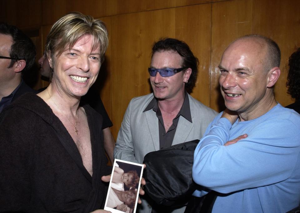 David Bowie, Bono and Brian Eno in 2002.