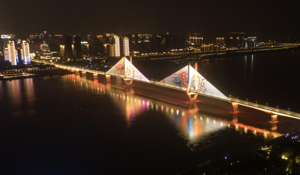 WUHAN, April 8, 2020 .Aerial photo taken on April 8, 2020 shows an illuminated bridge in Wuhan, central China's Hubei Province. Wuhan, the megacity in central China, started lifting outbound travel restrictions from Wednesday after almost 11 weeks of lockdown to stem the spread of COVID-19. (Photo by Cheng Min/Xinhua via Getty) (Xinhua/Cheng Min via Getty Images)