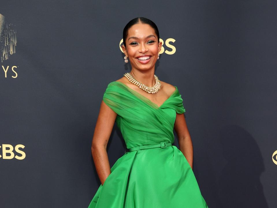 Yara Shahidi wears a green dress at the Emmys.