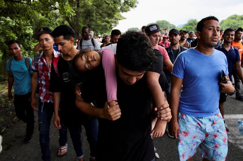 Migrants take part in a new U.S.-bound caravan in southern Mexico