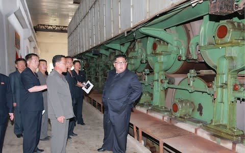 Kim Jong-un inspects the Sinuiju Chemical Fibre Mill - Credit: AFP