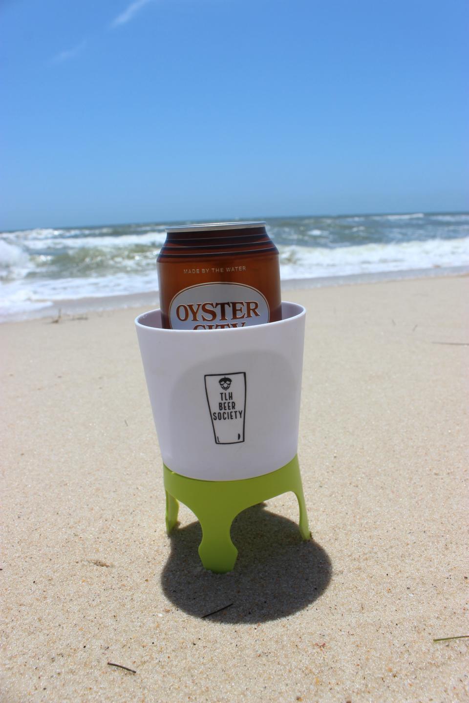 TLH Beer Society gave away "sand caddies," a plastic drink holder that sticks in the sand at the beach, at the 5th Annual SGI Brewfest