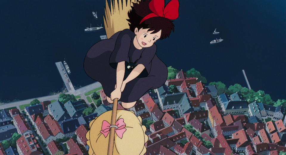 Kiki’s Delivery Service – Kiki soaring in the skies on her first delivery with Jiji the black cat.   