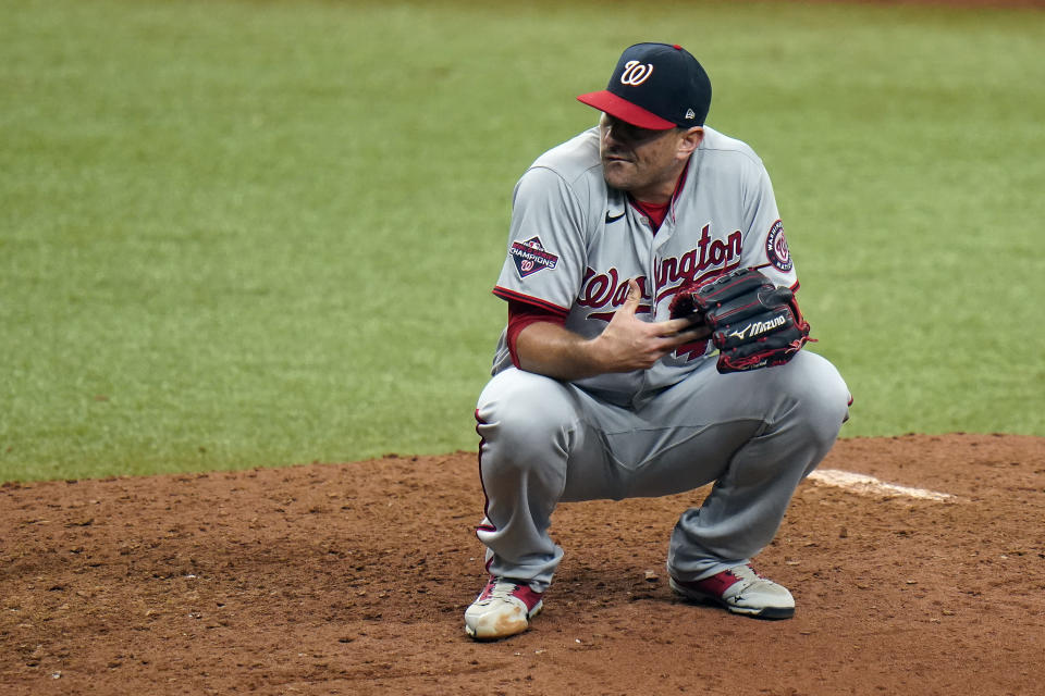 Washington Nationals' Daniel Hudson reacts after giving up a solo home run to Tampa Bay Rays' Brandon Lowe during the ninth inning of a baseball game Wednesday, Sept. 16, 2020, in St. Petersburg, Fla. (AP Photo/Chris O'Meara)