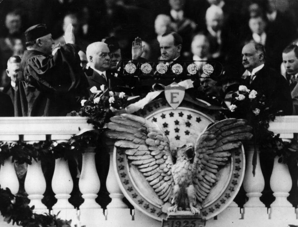 The inauguration of Calvin Coolidge (1872 - 1933) as the 30th President of the United States of America. Chief Justice of the Supreme Court and former President, William Howard Taft (left) administers the oath (Getty Images)