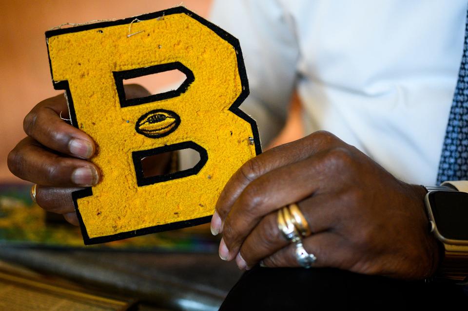 Ernest Hamilton holds his Beck High School varsity letter. Hamilton was part of the last graduating class at Beck before Greenville County Schools integrated in 1970.