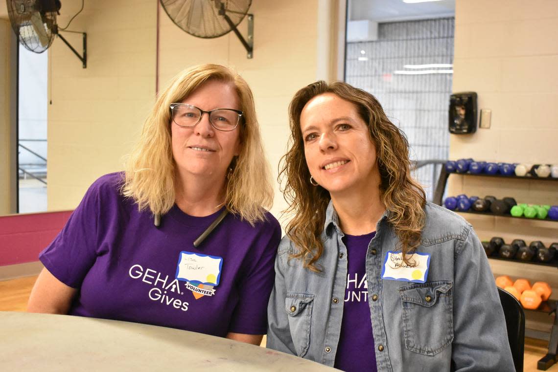 Lisa Towler and Stahr Ashurst of the Government Employees Health Association volunteer at the Linwood YMCA on Martin Luther King Jr. Day.