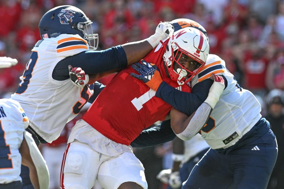 LINCOLN, NEBRASKA - AUGUST 31: Jimari Butler #1 of the Nebraska Cornhuskers fights through the block of Otis Pitts III #59 of the UTEP Miners during the third quarter at Memorial Stadium on August 31, 2024 in Lincoln, Nebraska. (Photo by Steven Branscombe/Getty Images)